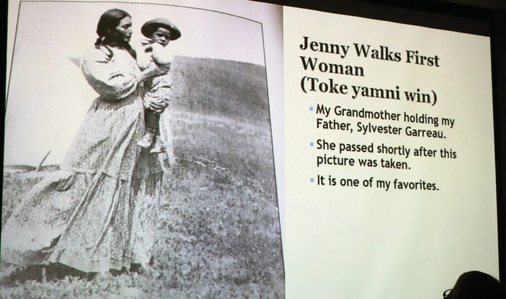 Monica Garreaux Schmidt shares the story of her grandmother Jenny Walks First Woman (Toke yamni win) during a Community Relations Commission-sponsored event at the Rapid City Library. (Photo by Marnie Cook)