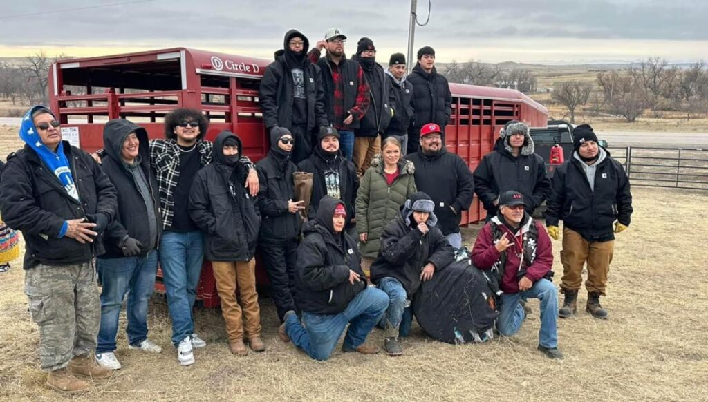 Sacred Storm crew celebrating the release of their first buffalo herd at their newly aquired Wambli Ska ranch east of Caputa. (Photo courtesy Sacred Storm)