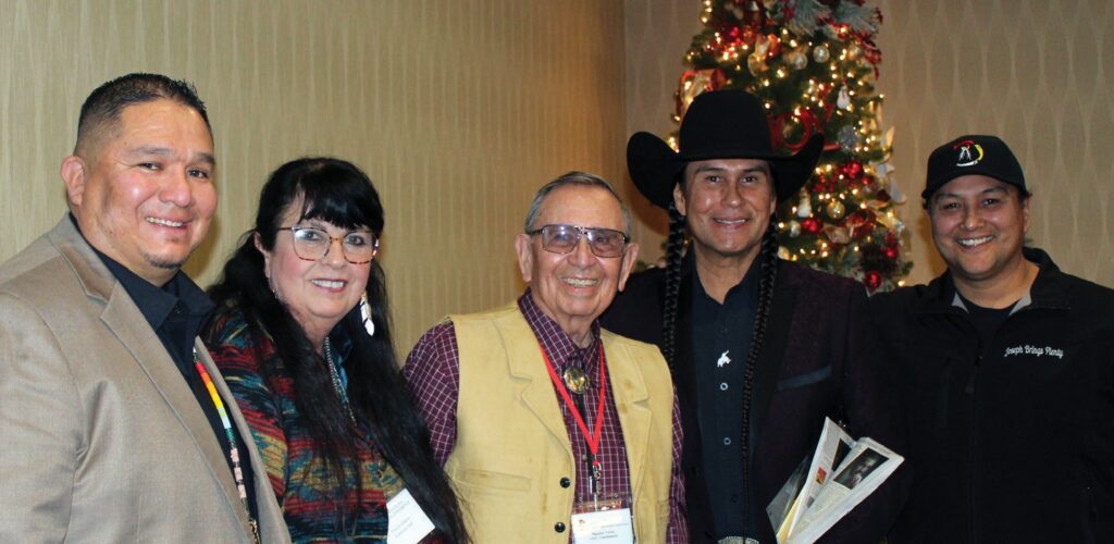 Whitney Rencountre, Mary Jo Gibbons, Maurice Twiss, Moses Brings Plenty and his brother Joseph Brings Plenty at the Lakota Nation Education Conference at the Ramkota Best Western in Rapid City. (Photo by Kirk Dickerson)