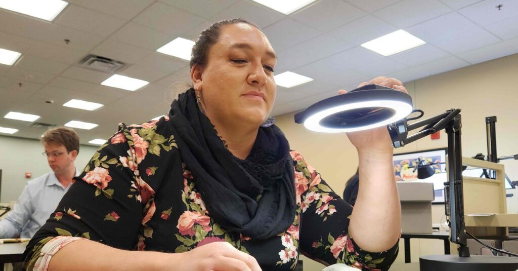 Prairie Rose Seminole (MHA Nation) is the main contact for information about the Bismarck Indian School Digital Repatriation Project; here digitizing records Jan. 3, 2025 at the Kansas City National Archive. (Dennis J. Neumann photo)