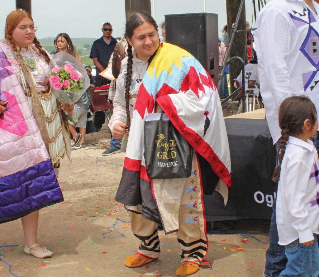 Maverick Gray Horse, AA in Lakota Studies participates in the Round Dance. (Photo by Ernestine Anunkasan Hopa)