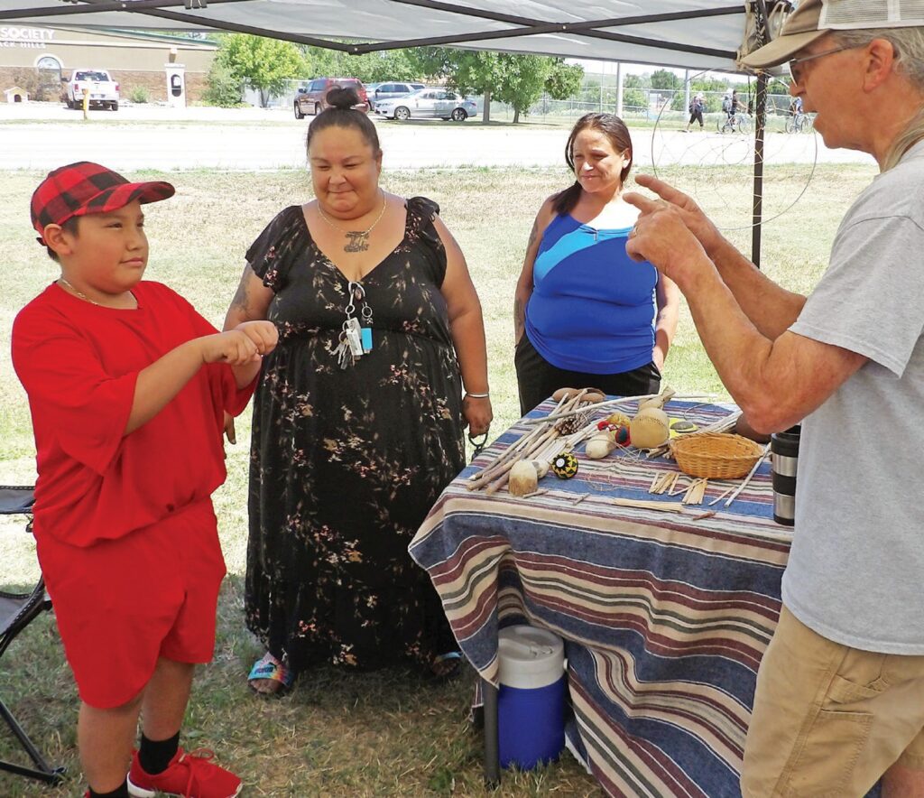 Ricky plays a game of chance. (Photo by Marnie Cook)
