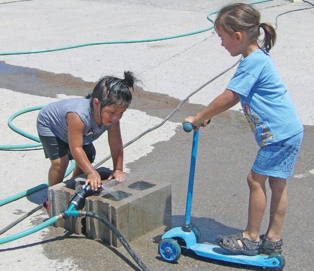 Kids playing in the water the WSDCA anniversary celebration. (Photo by Marnie Cook)