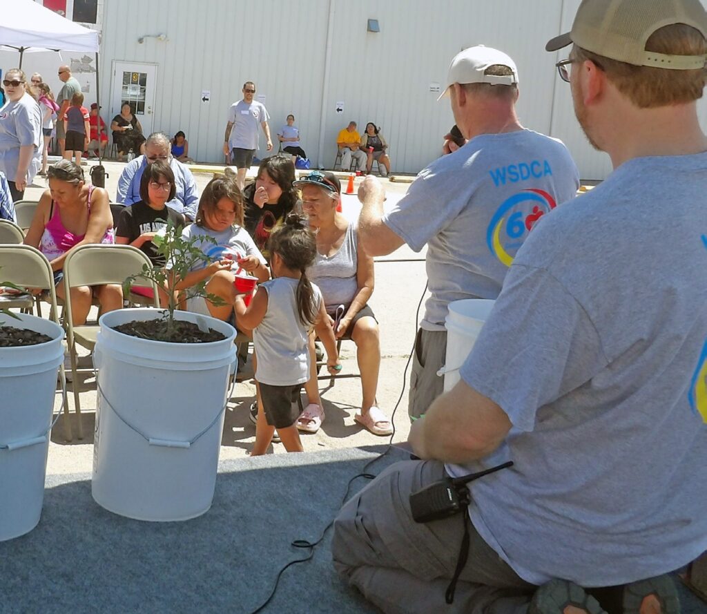 Sean Burke and staff calling out raffle numbers. (Photo by Marnie Cook)
