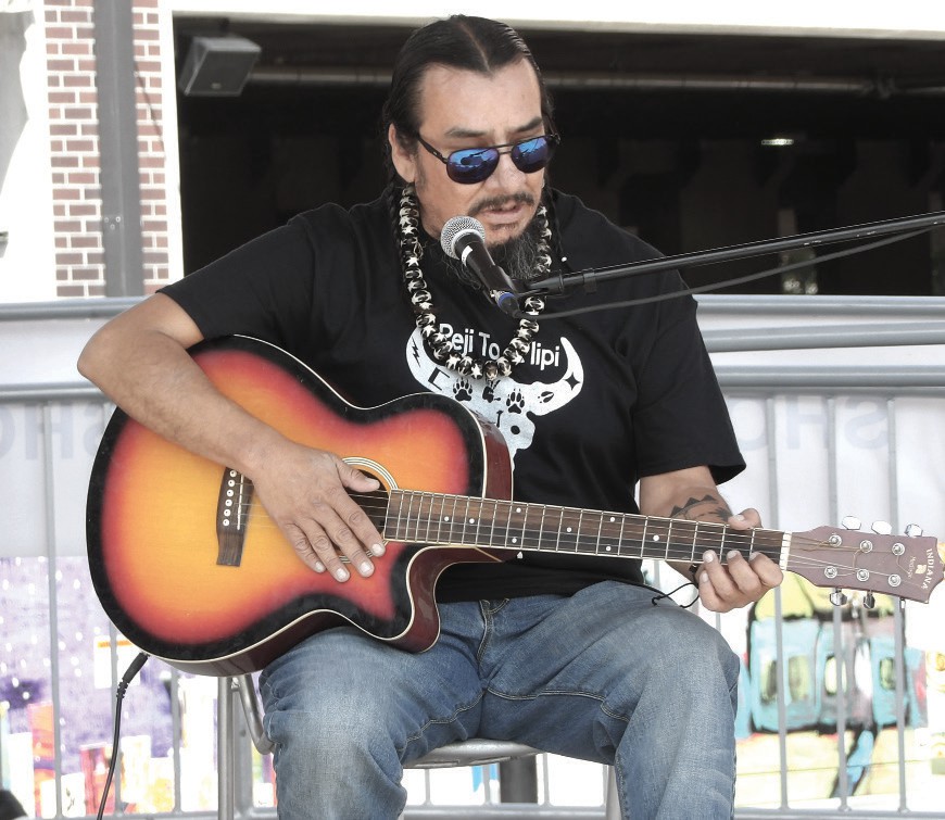 Santee Witt playing originals and covers at Native POP 2025. (Photo by Marnie Cook)