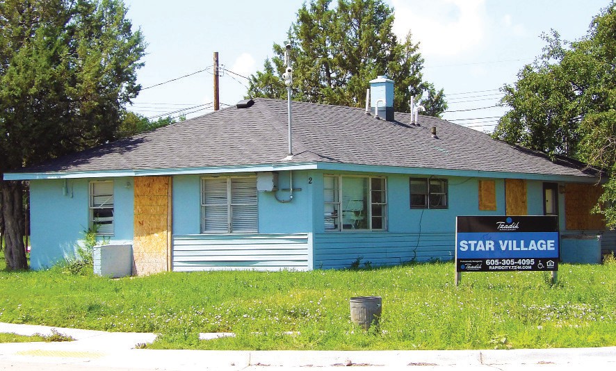 Boarded up home at Star Village. (Photo by Marnie Cook)