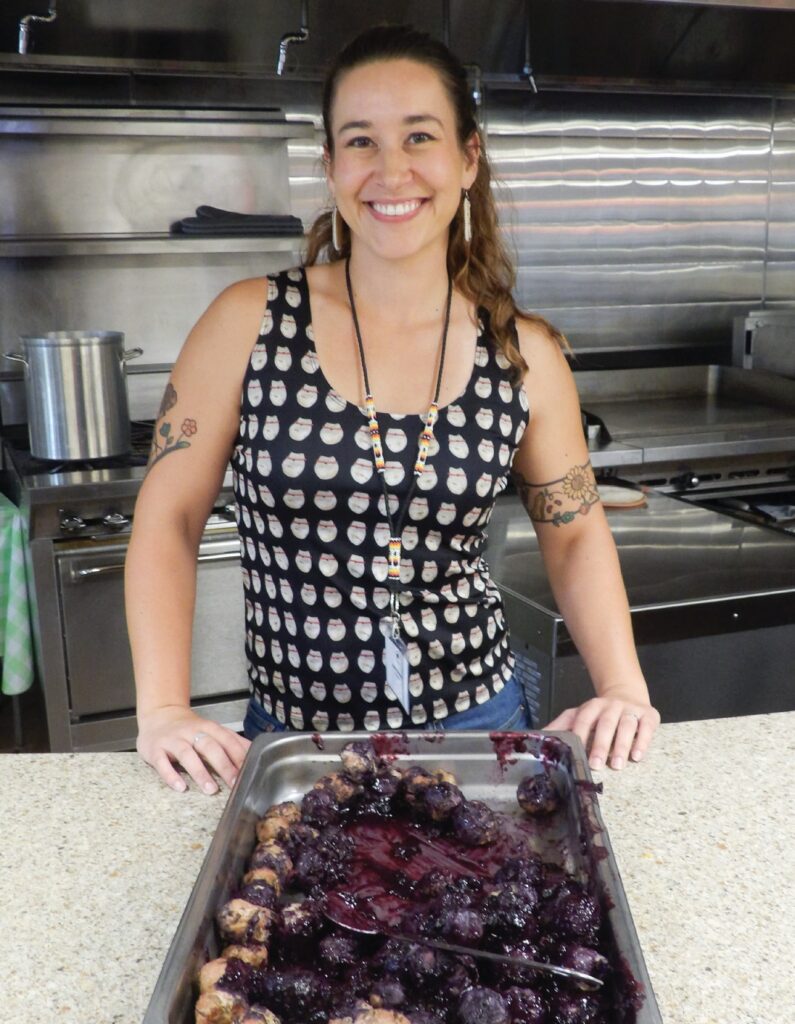 Mariah Gladstone with a pan of turkey meatballs with berry sauce. (Photo by Marnie Cook)