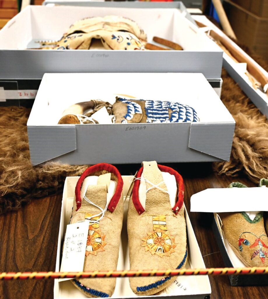 Two pairs of moccasins, an intricately beaded bag, a bow and a small doll were among the items plundered more than a century ago from a Lakota community massacred in western Nebraska. (Jessica Wade, Nebraska Public Media)