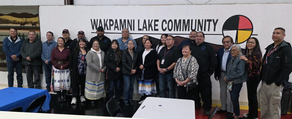 Oglala Sioux Tribe Council members, Rosebud Sioux Tribal council members, Oglala Lakota Telecommucations LLC staff and members of the RST Broadband Project at the Wakpamni Lake Communicty Center. Photo by Marnie Cook.
