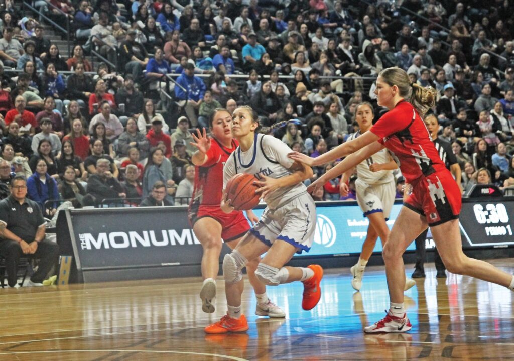 LNI MVP (1) Ashlan Carlow-Blount splits Lakota Tech defenders Isabella Shangreaux (L), Lizzie Robinson (R) and (0) Mya Mills in background. (Photo by Michele Davies)