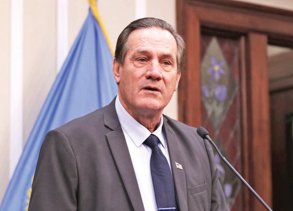 South Dakota Republican Gov. Larry Rhoden speaks to members of the media at the Capitol in Pierre on Feb. 12, 2026. (Photo by Makenzie Huber/ South Dakota Searchlight)