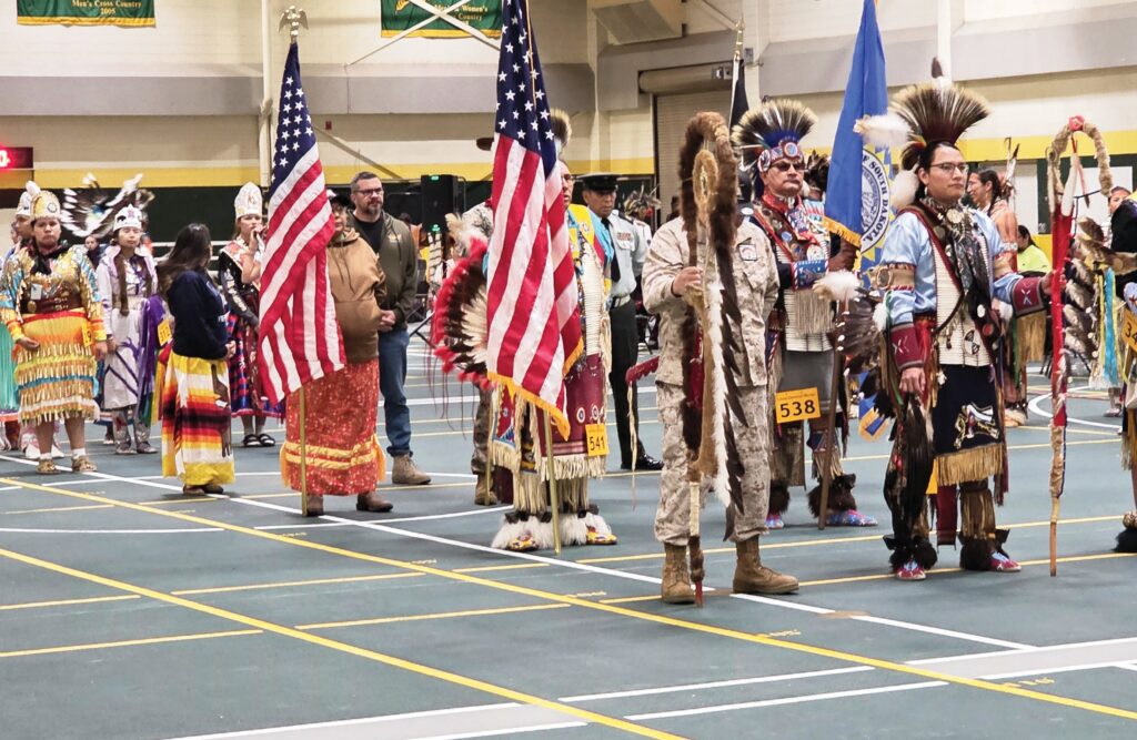 Grand entry at the 41st annual Lakota Omniciye Wacipi. (Photo by Marnie Cook.)