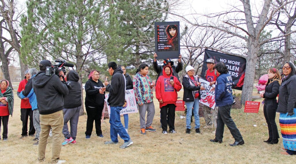 On what would have been Sahela Toka Win Sangrait’s 23rd birthday, March 26, 2026, an honor line of family members formed during a vigil near the Journey Museum. At the center stands her mother, Hillary Dubray. (Photo by Ernestine Anunkasan Hopa)