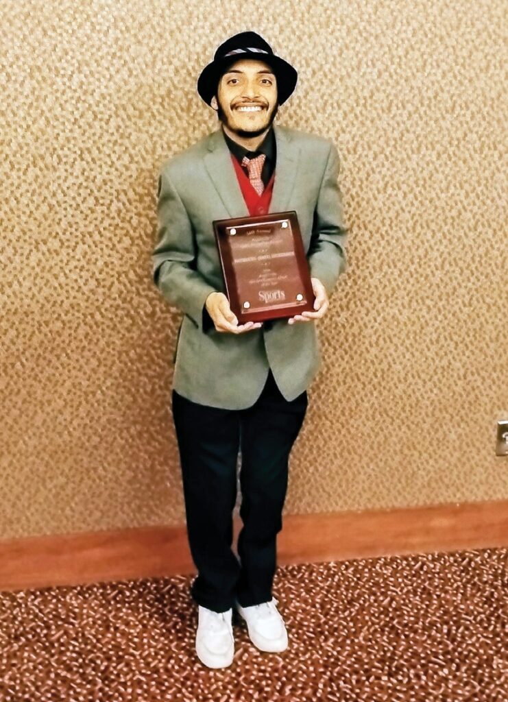 Nathaniel Dickerson displaying his plaque. (Photo by Kirk Dickerson)