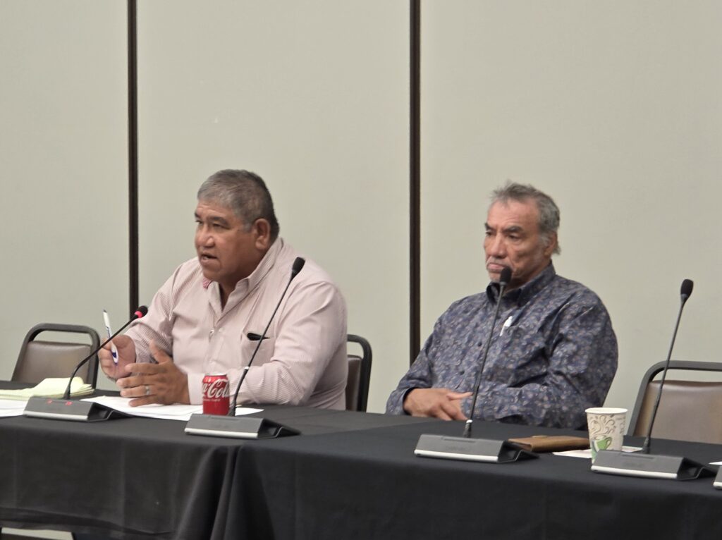 (L .to R.) Harold Frazier with James White at the GTCPA special meeting in April . (Photo by Marnie Cook)