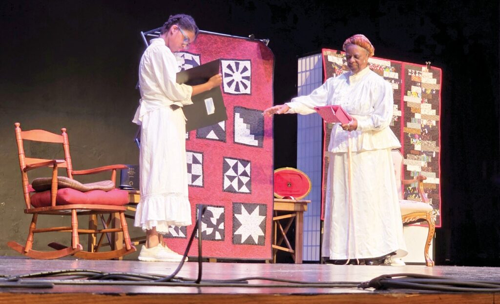 Joyce Jefferson as Tillman explaining the meaning of the quilt patterns. (Photo by Marnie Cook)