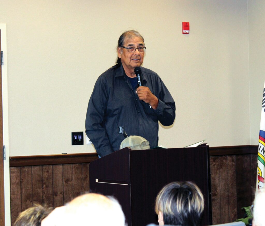 Dana Dupris speaks to the audience, explaining the cultural significance of the sculpture and reading a narrative honoring the Dupree family’s pivotal role in preserving the buffalo for future generations. (Photo by Ernestine Anunkasan Hopa)